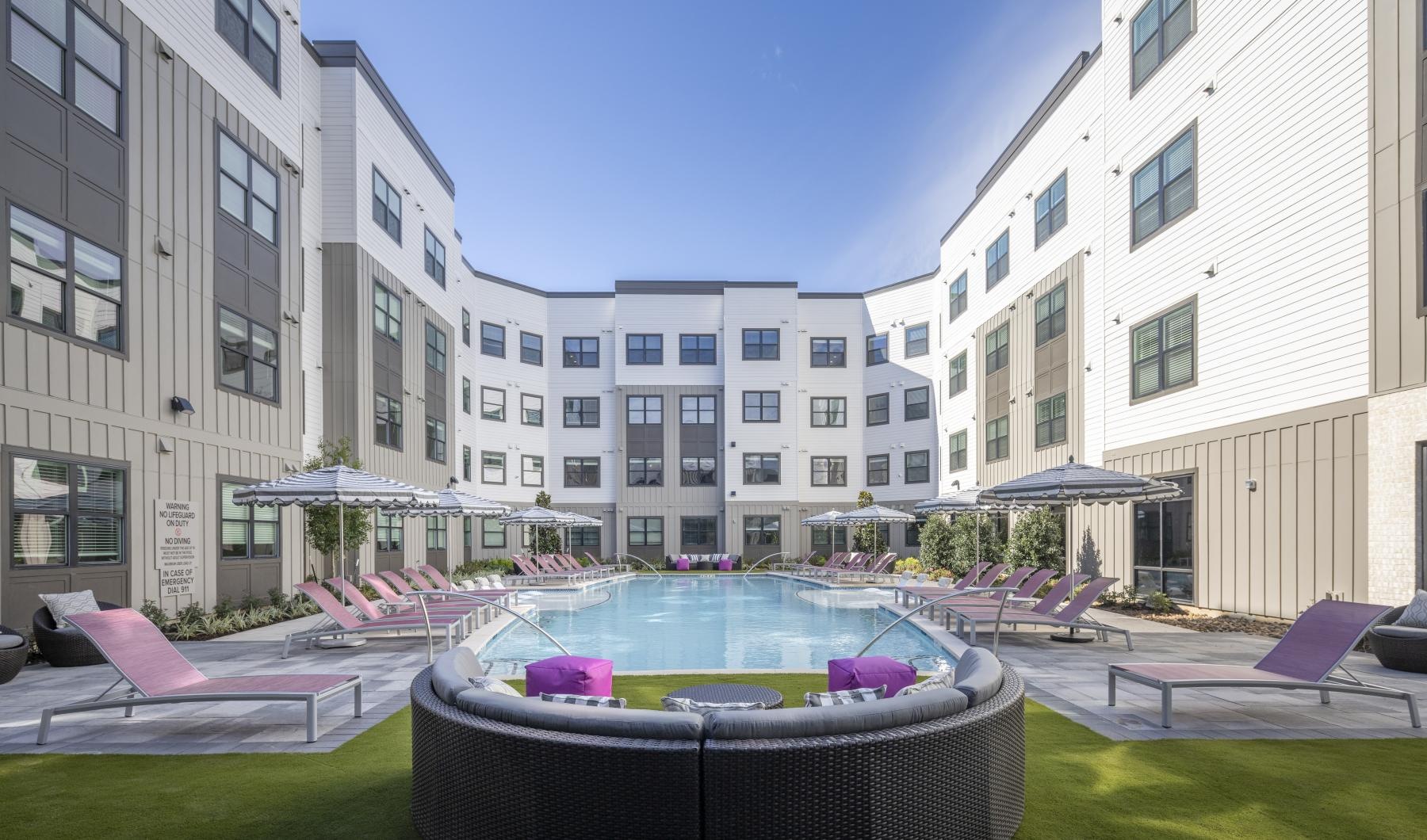 The essence of exceptional living a pool in a courtyard between buildings