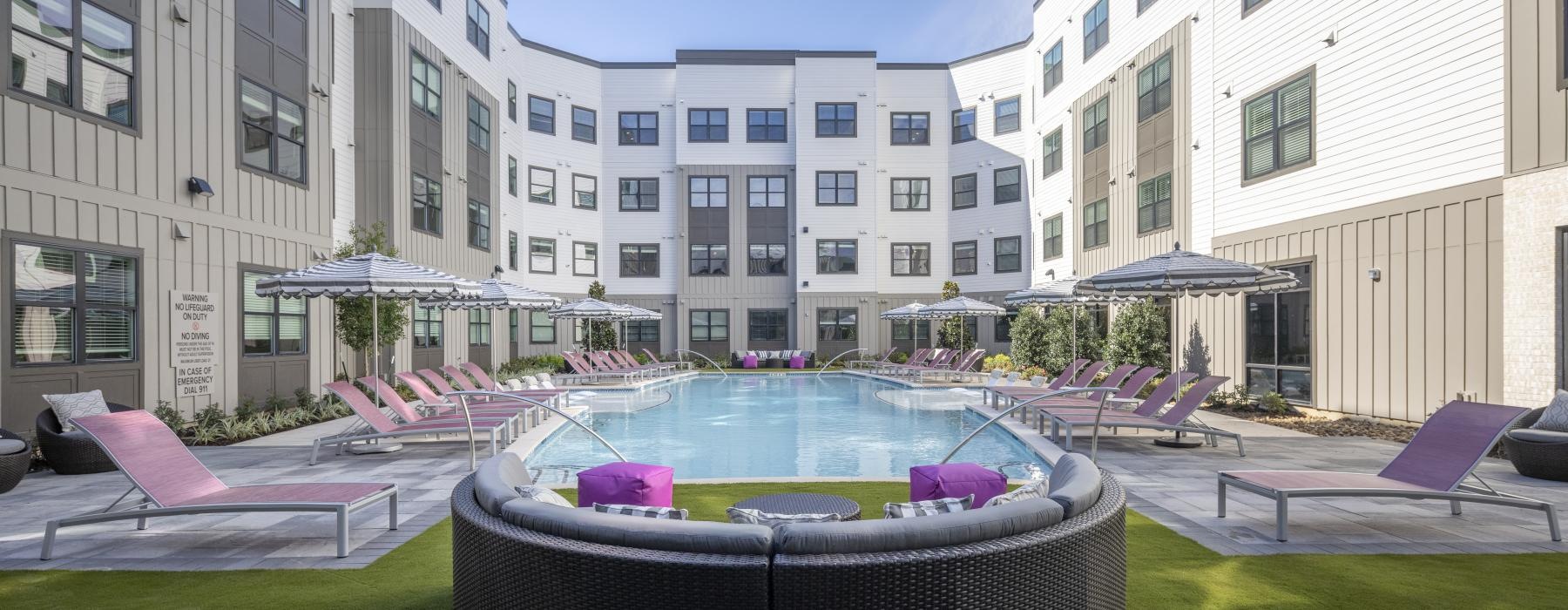 a pool in a courtyard between buildings