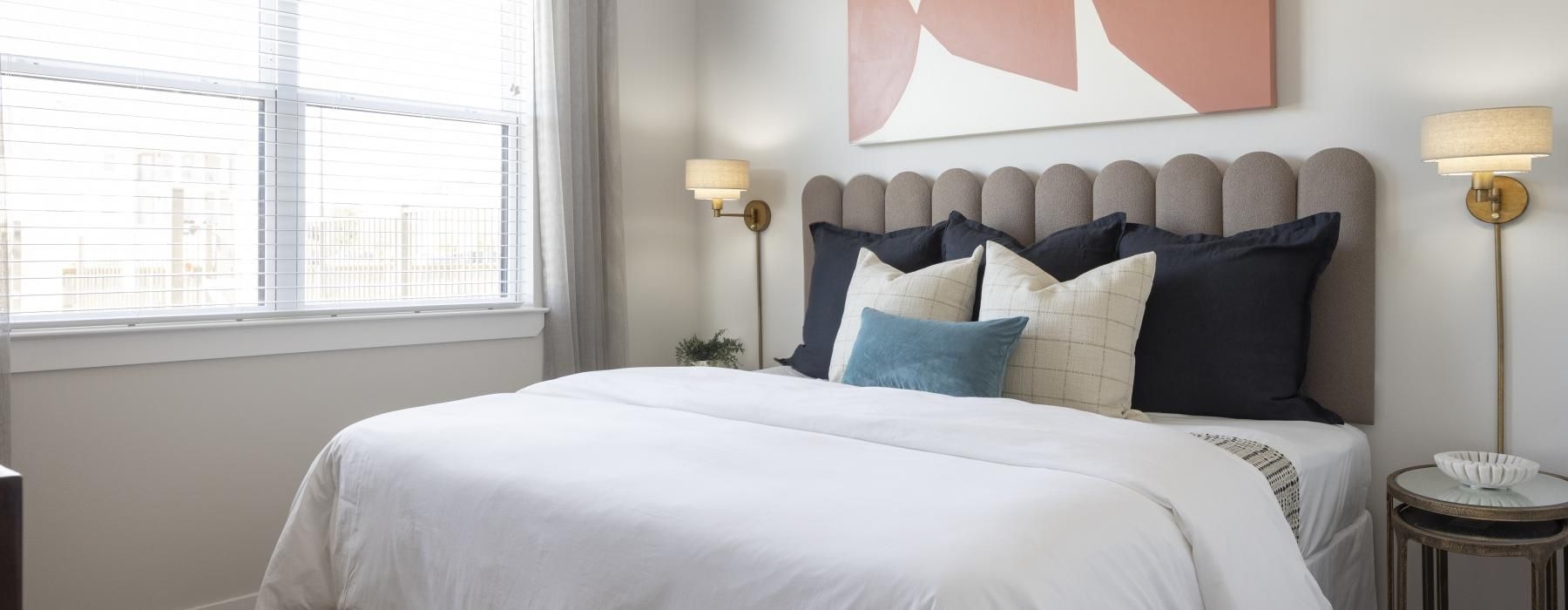 a bed with a white bed spread