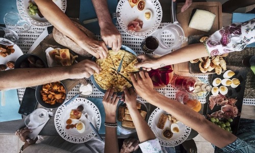 Restaurants people reaching for pizza