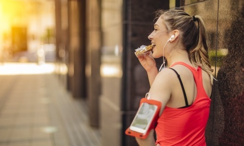 Entertainment & Recreational a woman outdoors with running gear on her arm