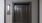 a black door with a light above it