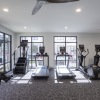 fitness center with rows of treadmills