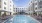 a pool in between property buildings