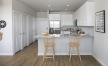 a kitchen with white cabinets